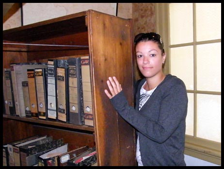Me about to enter behind the wsecret book case which hid the entrance into the Frank's secret household